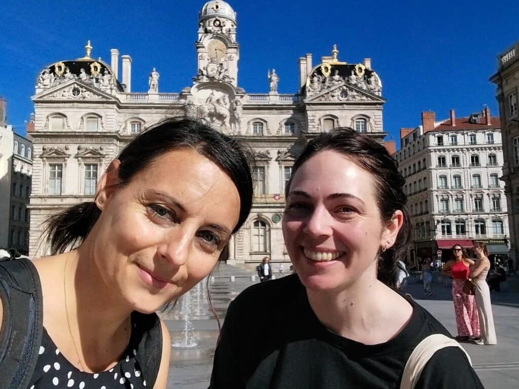 French teacher Hélène and student in front of the Lyon city hall