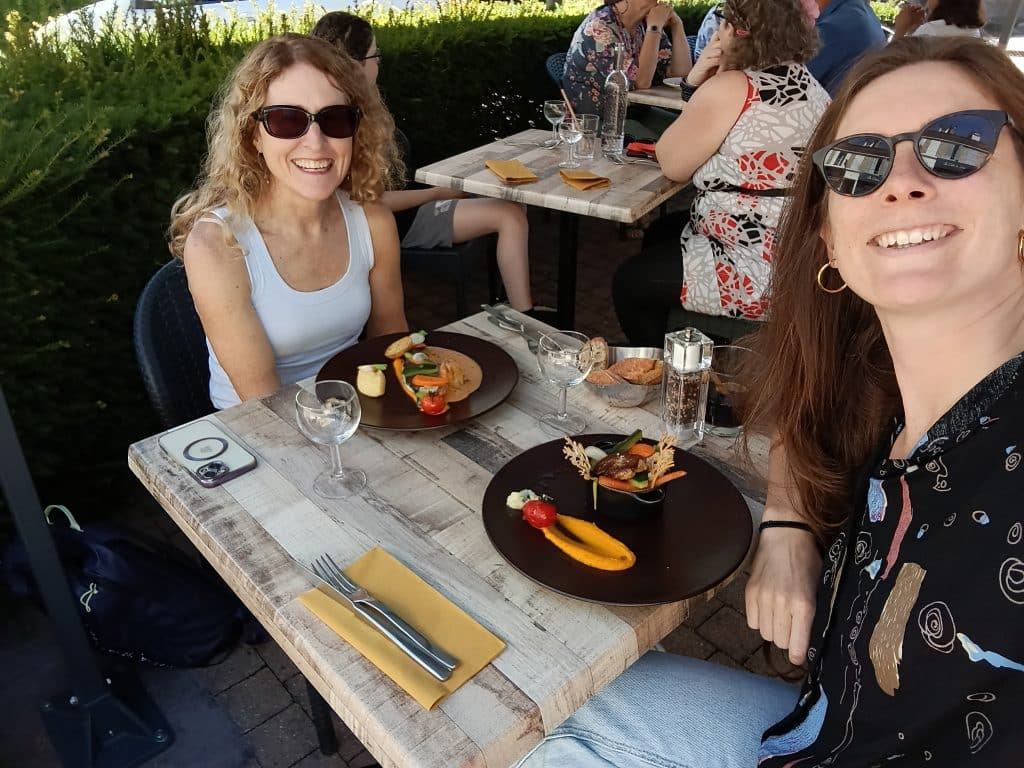 French teacher and student sharing a one-to-one lunch during a French immersion stay in Normandy