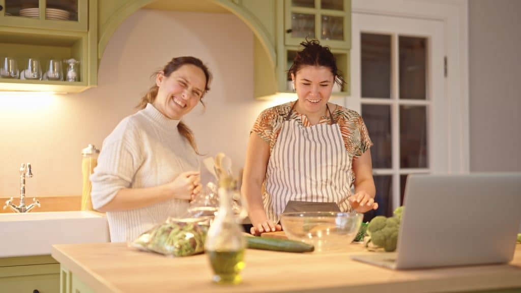 Teachr and student cooking together during homestay immersion